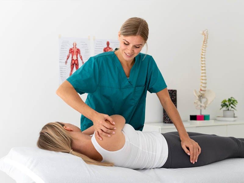 Physiotherapist treating a patient's leg
